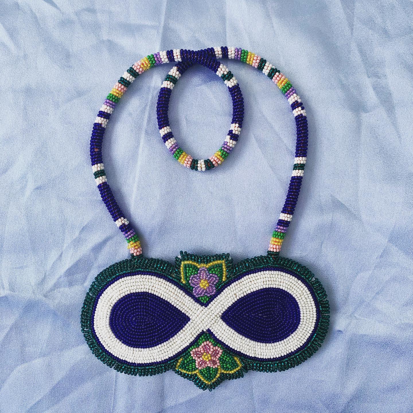 Beaded Métis infinity medallion with beaded rope.